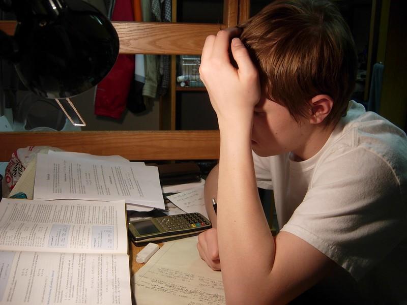 Student solving a math paper