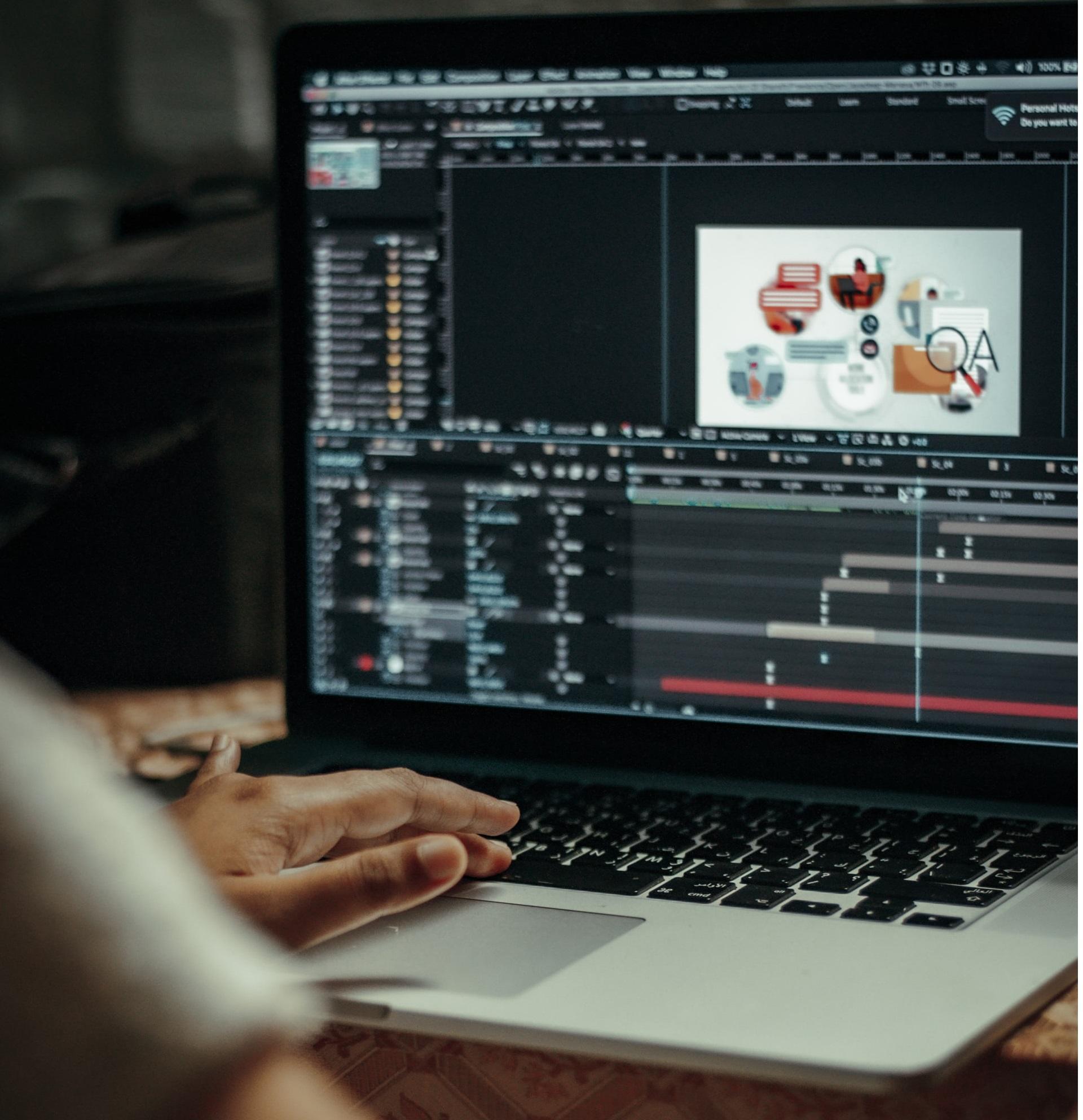 Animator designing artworks on a laptop