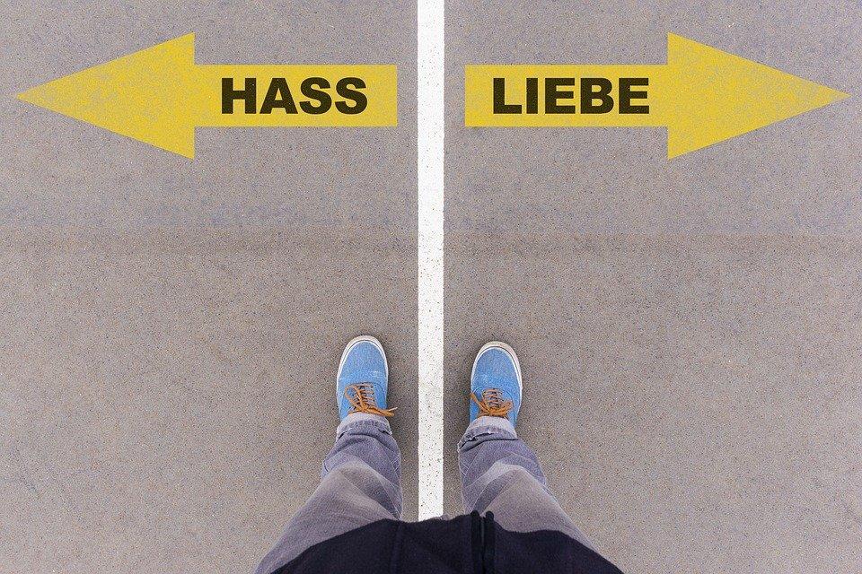 Two German words, on the left, mean hatred, and on the right, it means love
