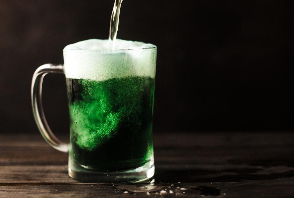 A green and white-colored drink