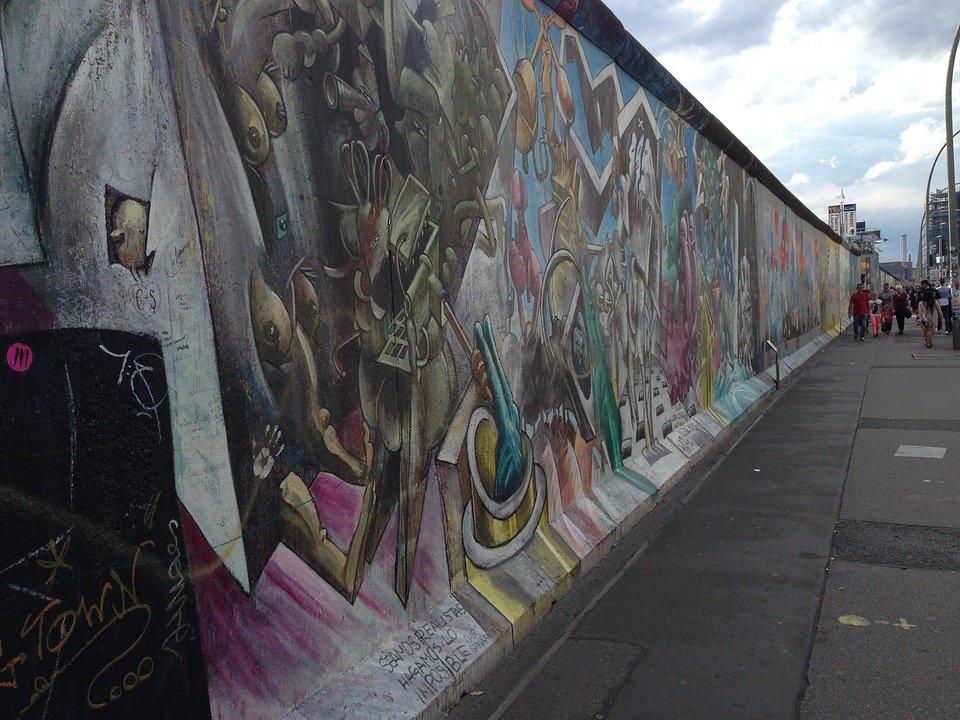 This is a famous Berlin wall art filled with iconic murals.