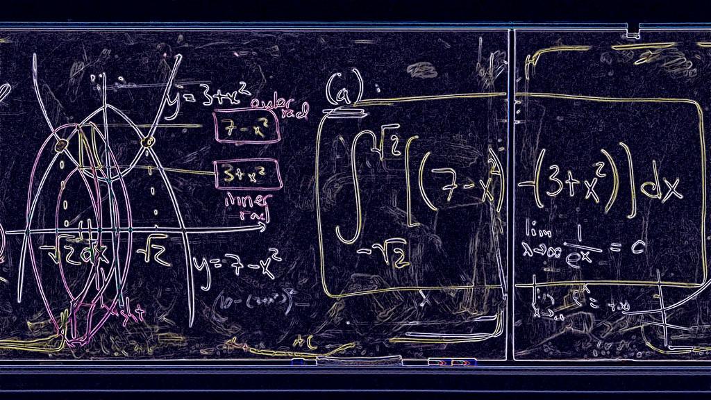 A blackboard busy with mathematic calculations