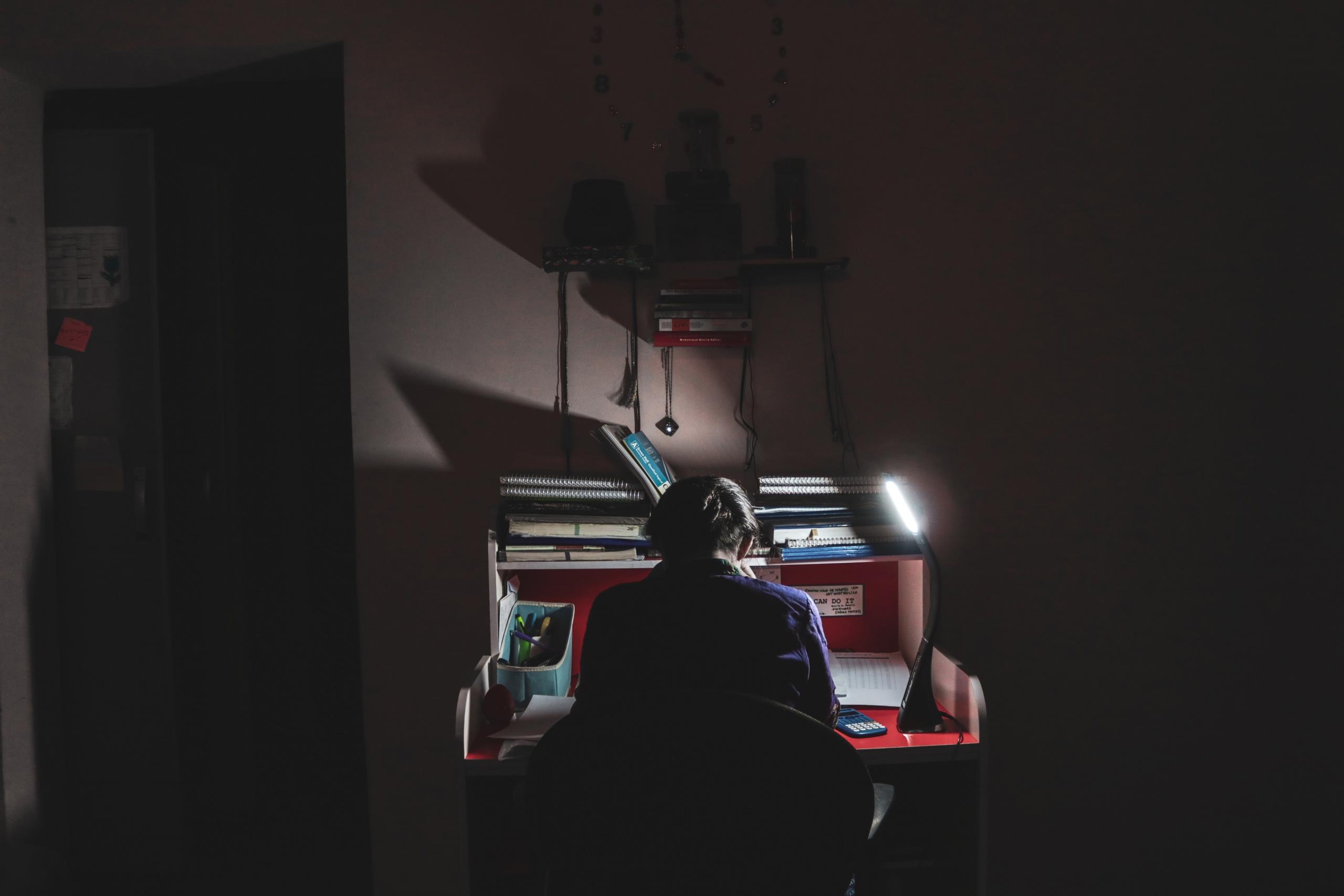 someone studying at the desk