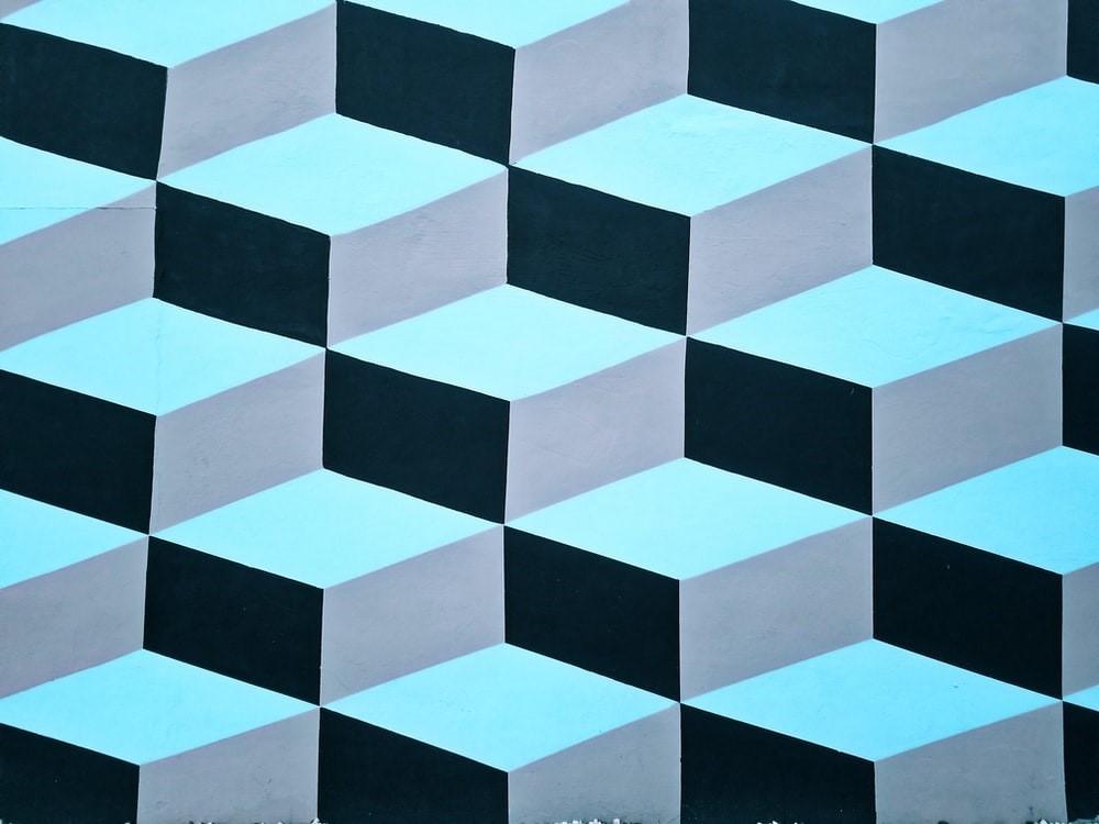 A 3-D illustration of black and blue textured textile