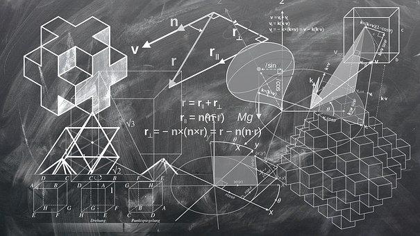 A blackboard covered in mathematical shapes and expressions