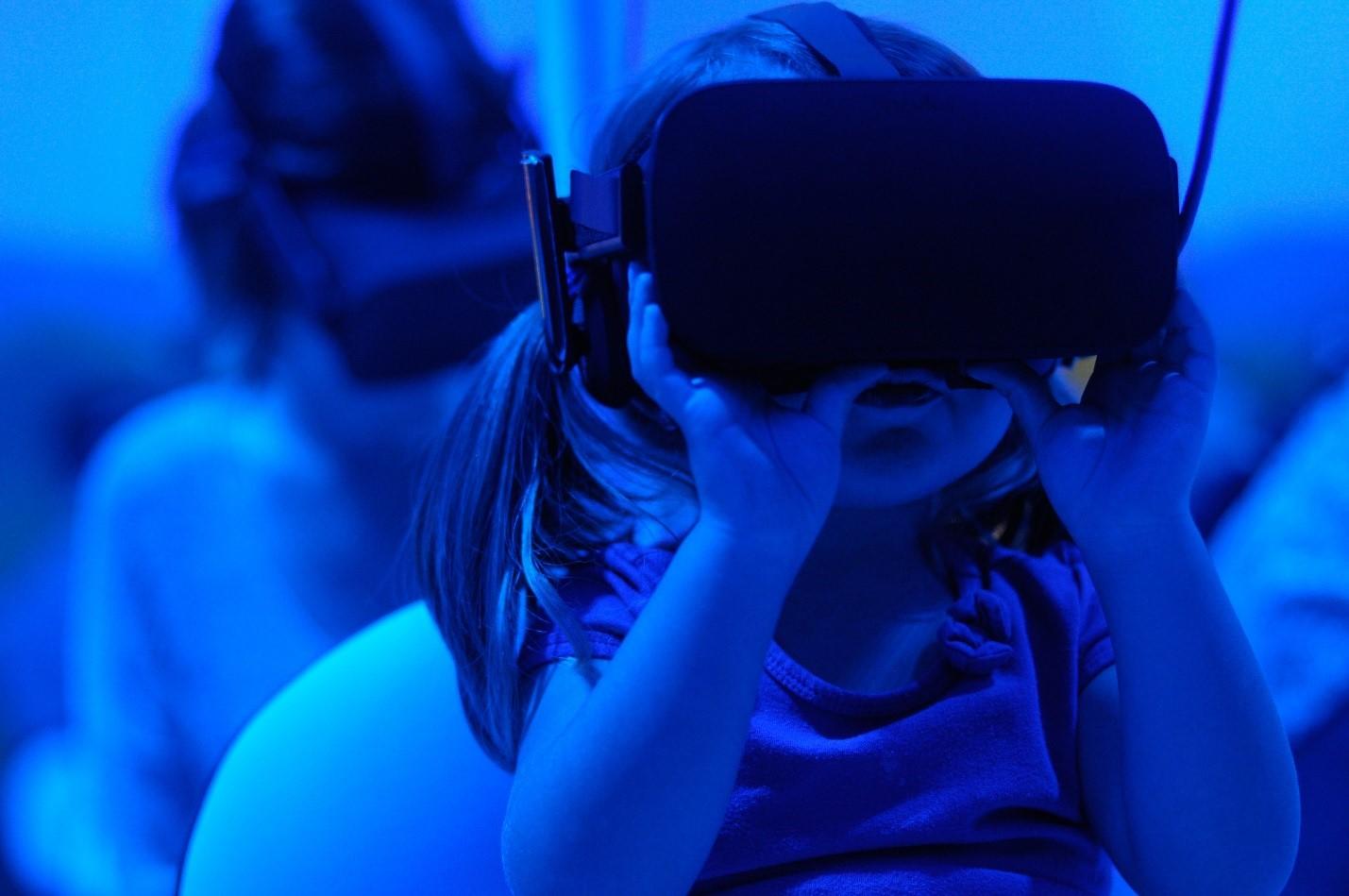 A girl using a VR headset