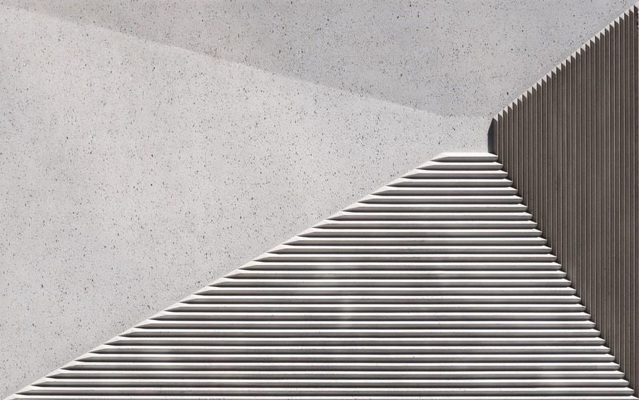 Grey textured wall with lines running across