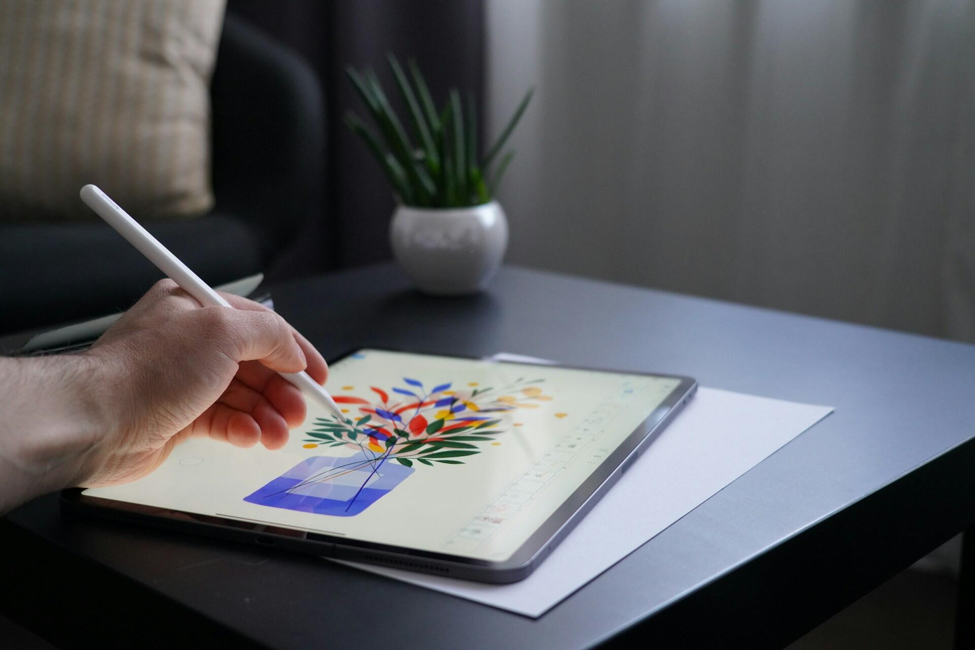 Someone drawing an illustration on an iPad.