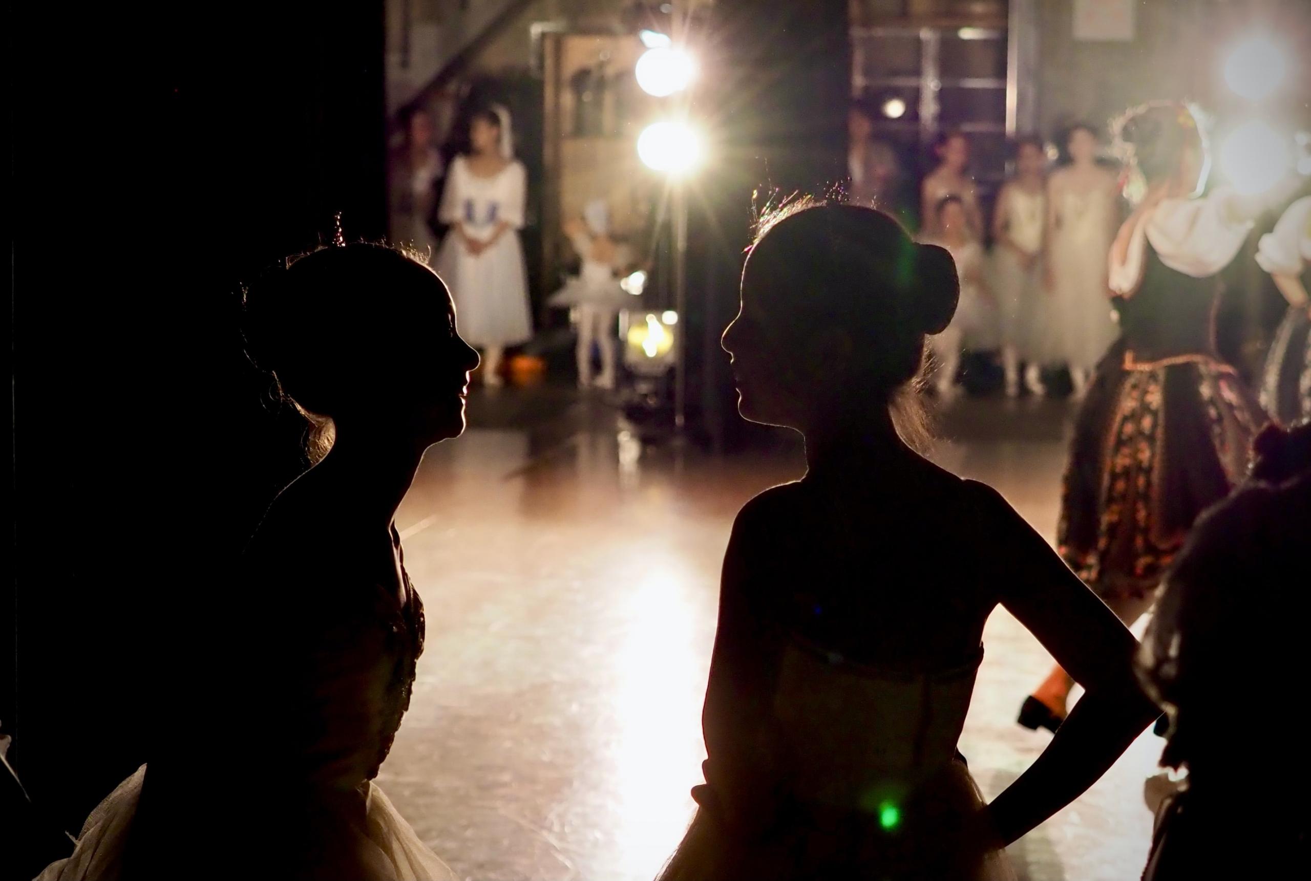 two girls preparing to dance flamenco