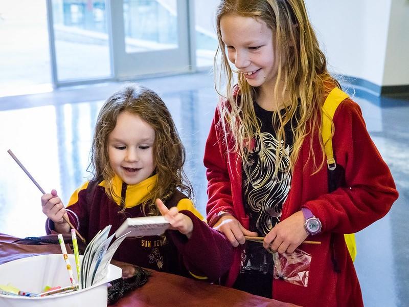 Children signing up for Latin class