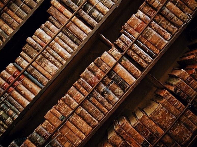 Bookshelf at a library with old books arranged in an organized manner