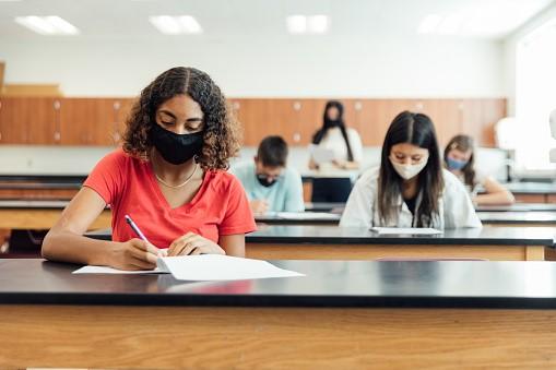 A class of high schoolers taking their Latin exams