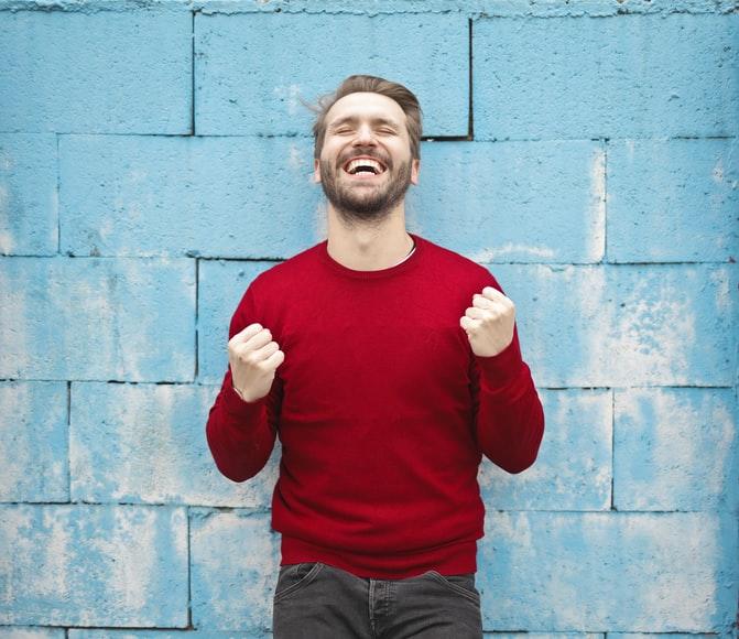 A joyous student in a red shirt