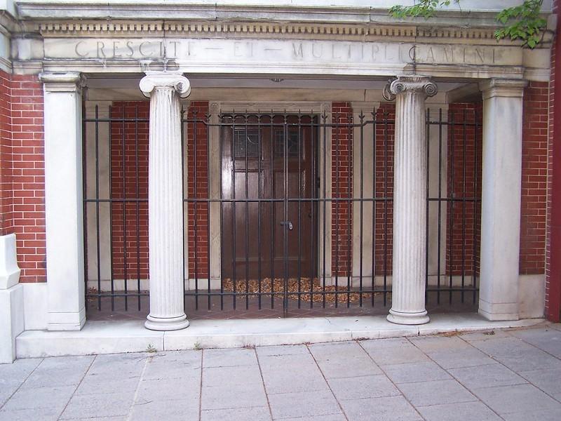 Latin text is written on a building
