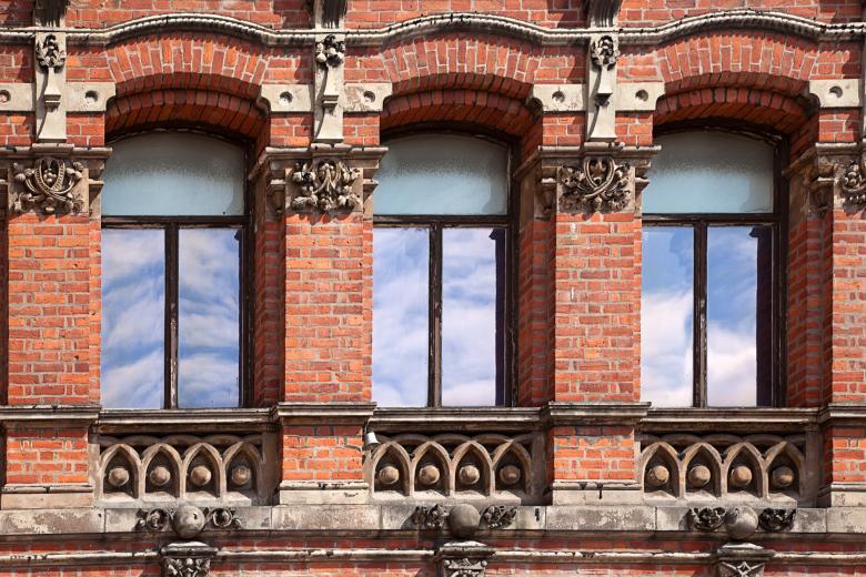 A building with intricate geometric windows and arches
