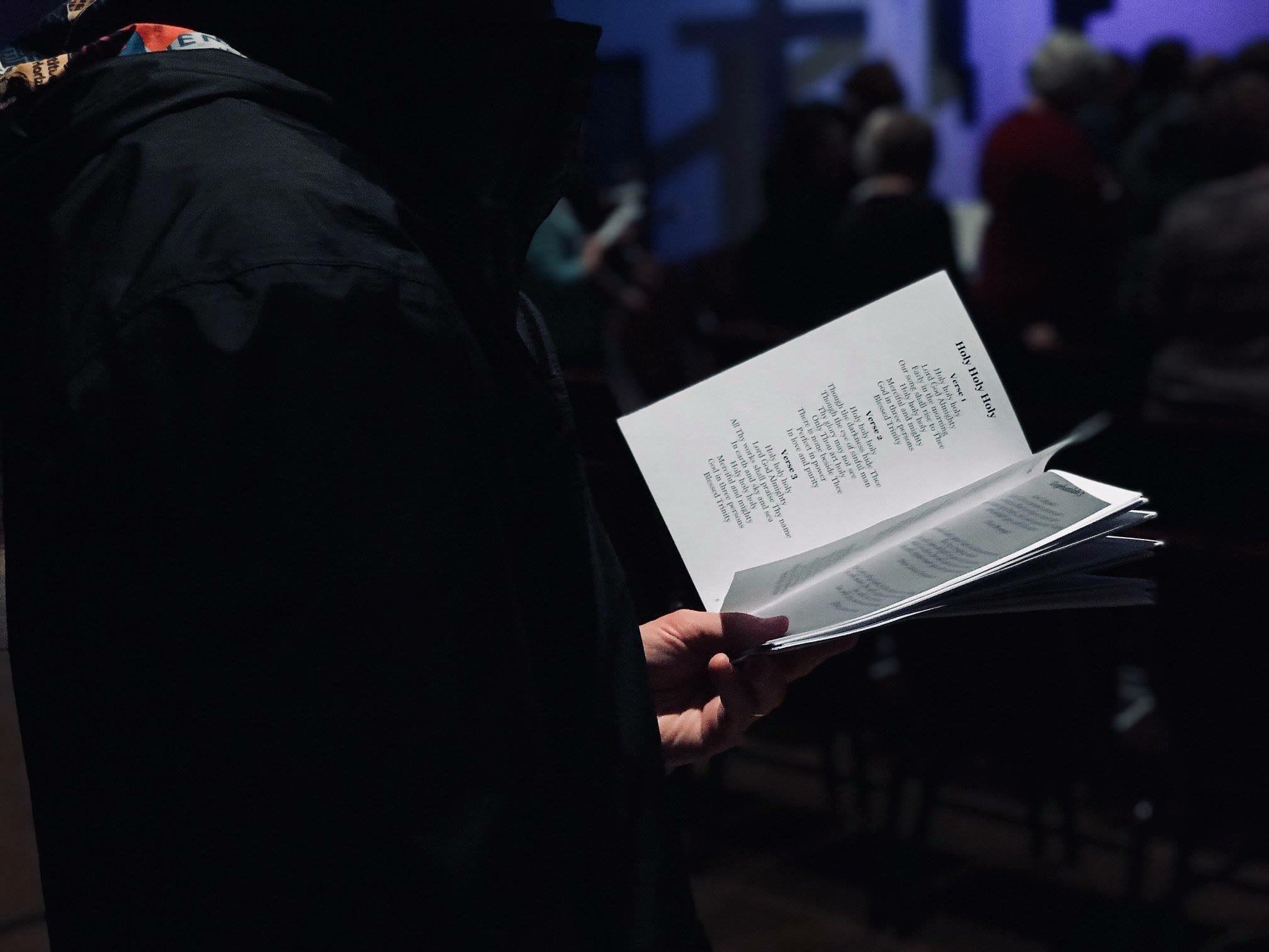 a person holding a photo book