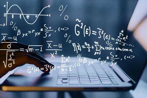 Someone using a laptop in the background, and mathematical concepts in the foreground