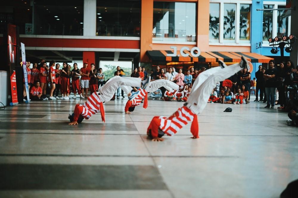 A crowd of people watching a breakdance battle
