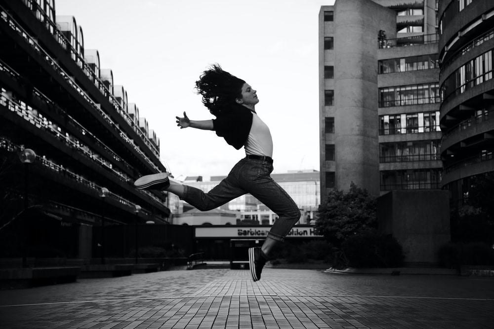 A dancer jumping high in the air