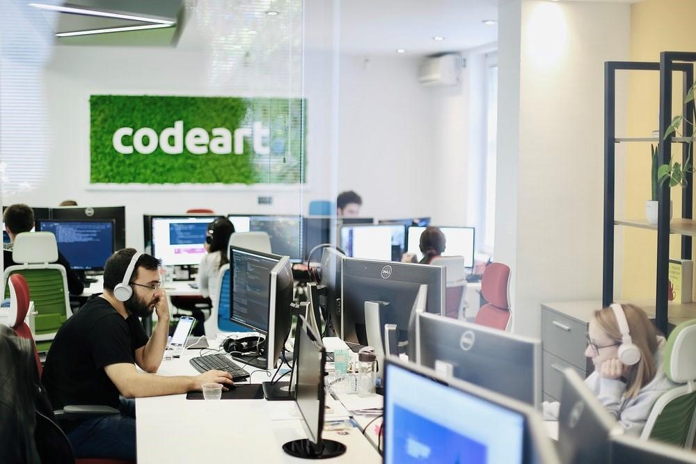 Employees using the company's computers in an office