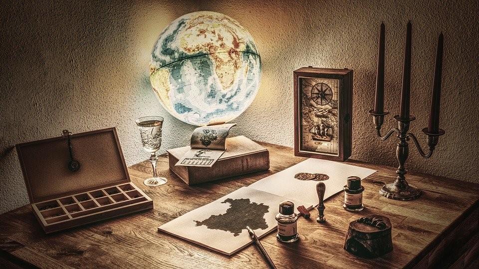 A painting of a globe along with other objects