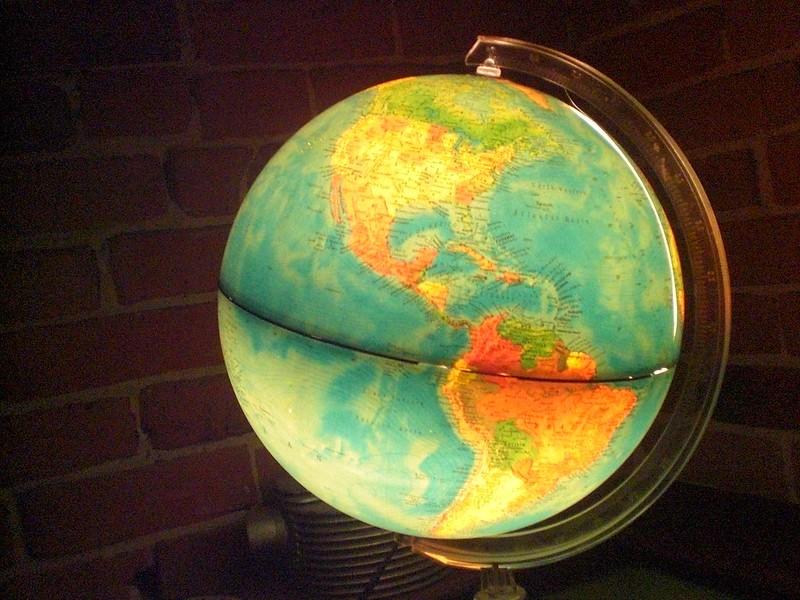 An illuminated globe on the table