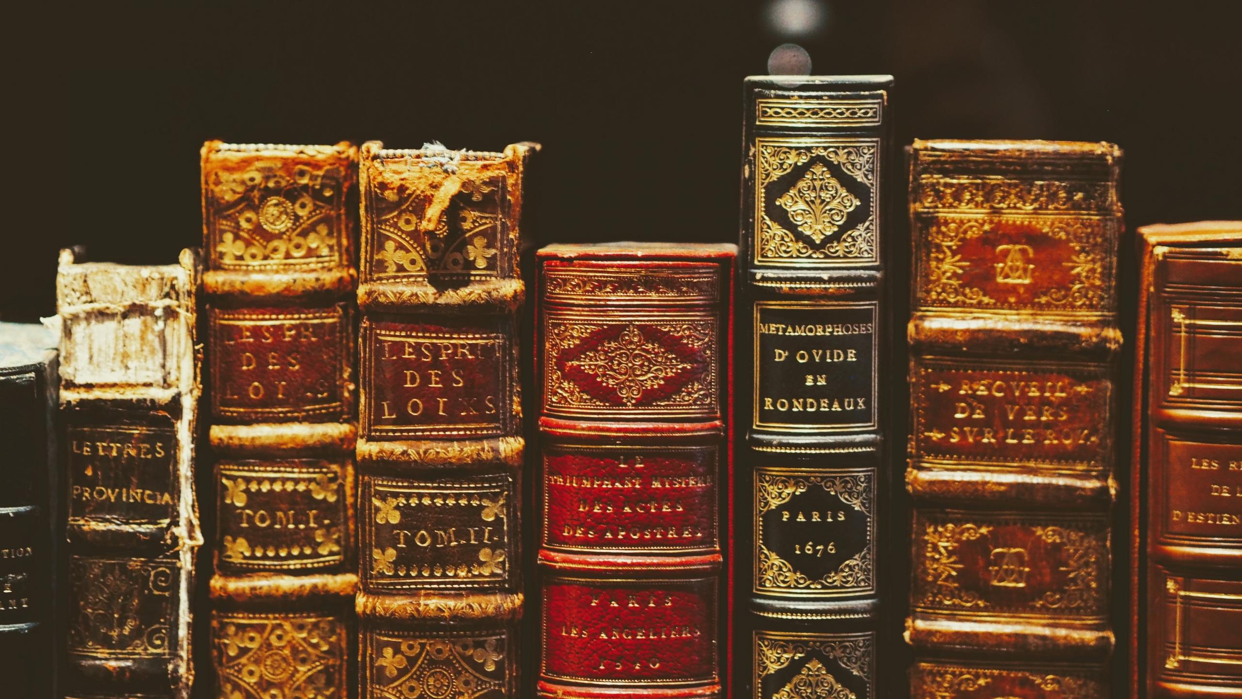 A collection of vintage books on a bookshelf