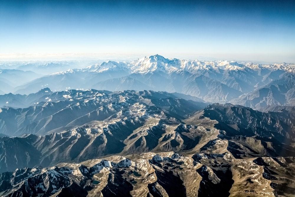 Aerial view of snow-covered mountains during daytime