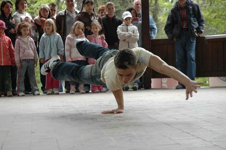A breakdancer showing his power moves