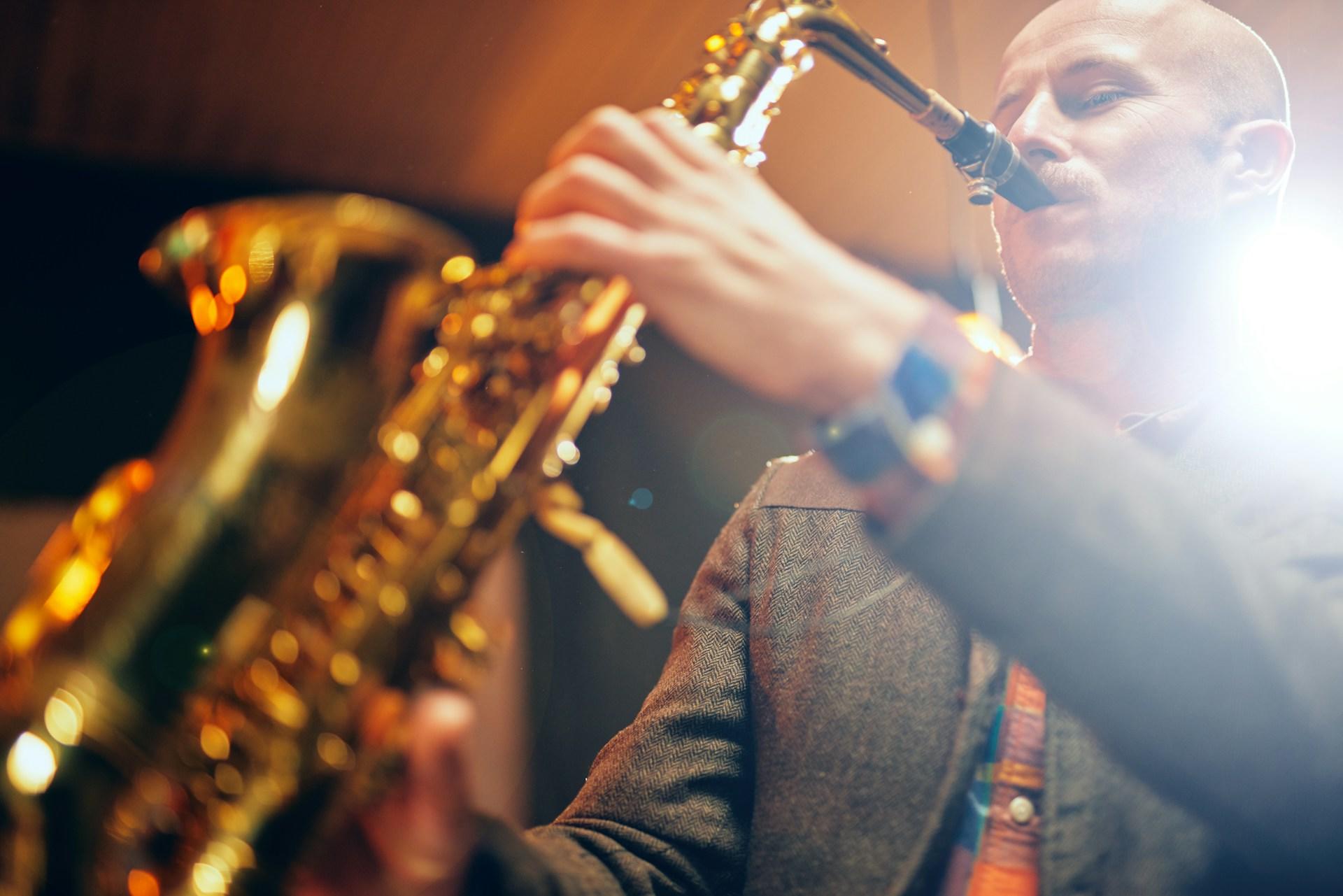 A guy playing the saxophone