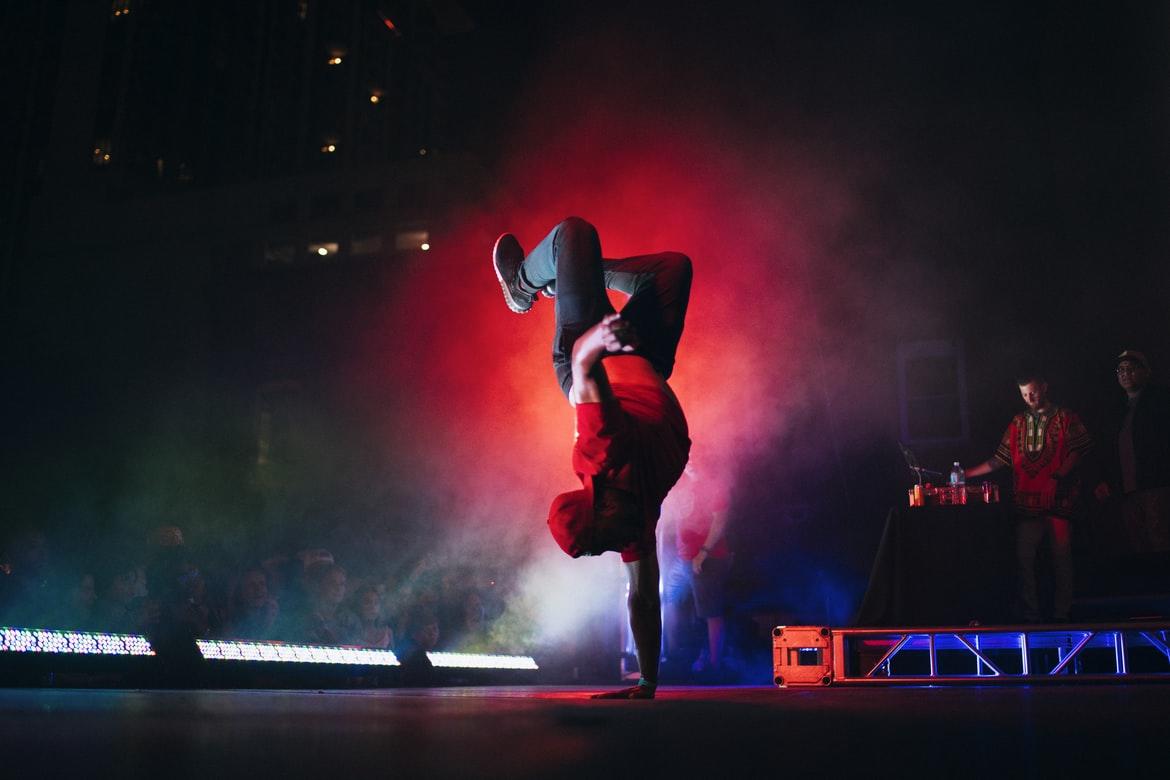 A breakdancer performing on the stage.