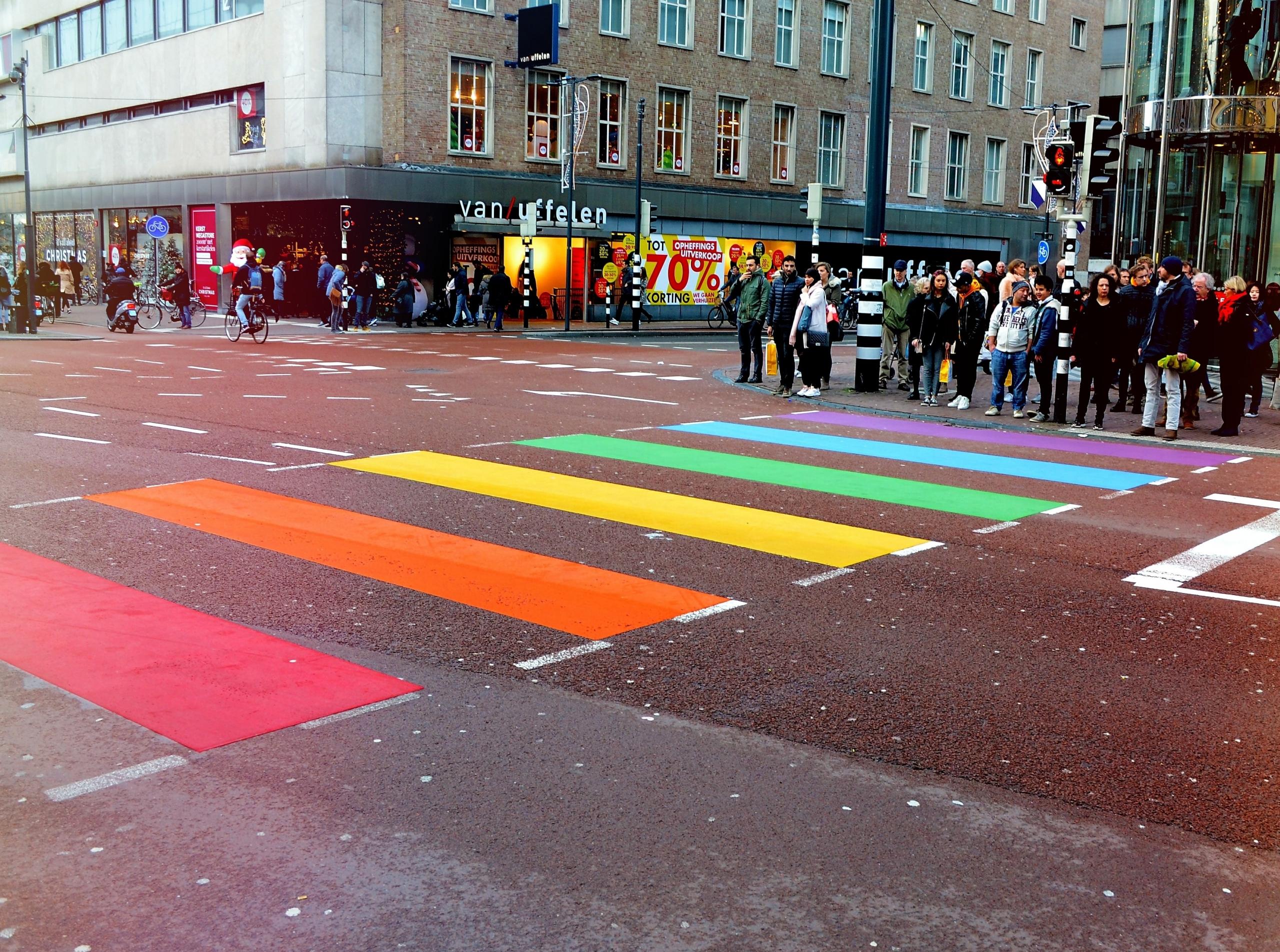 People are waiting to cross the famous "rainbow crossing"