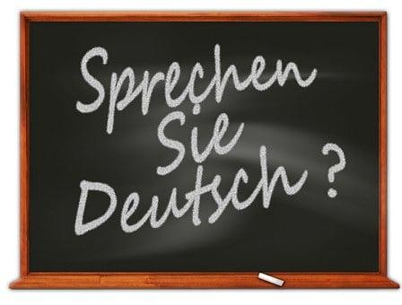 A blackboard reading 'Do you speak German?' in German