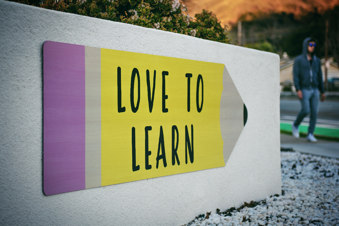 A signboard on a wall saying 