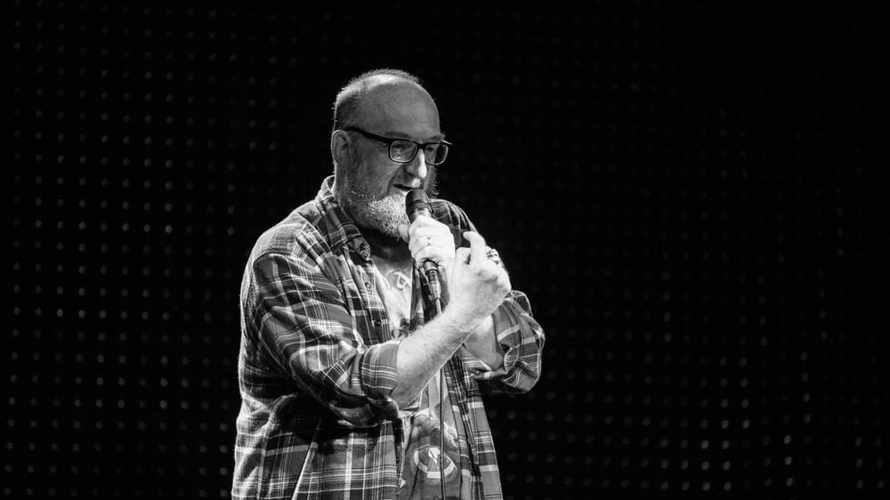 A stand-up comedian performing on stage