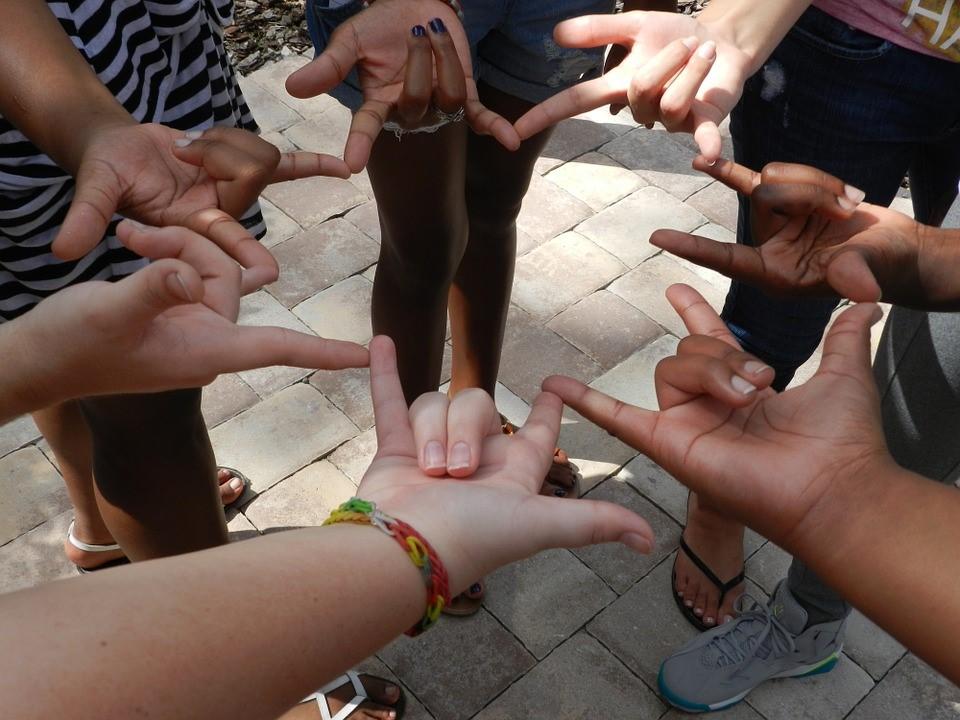 A group of people using sign language