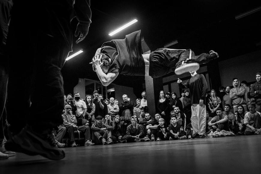 A breakdancer performing at a face-off dance battle