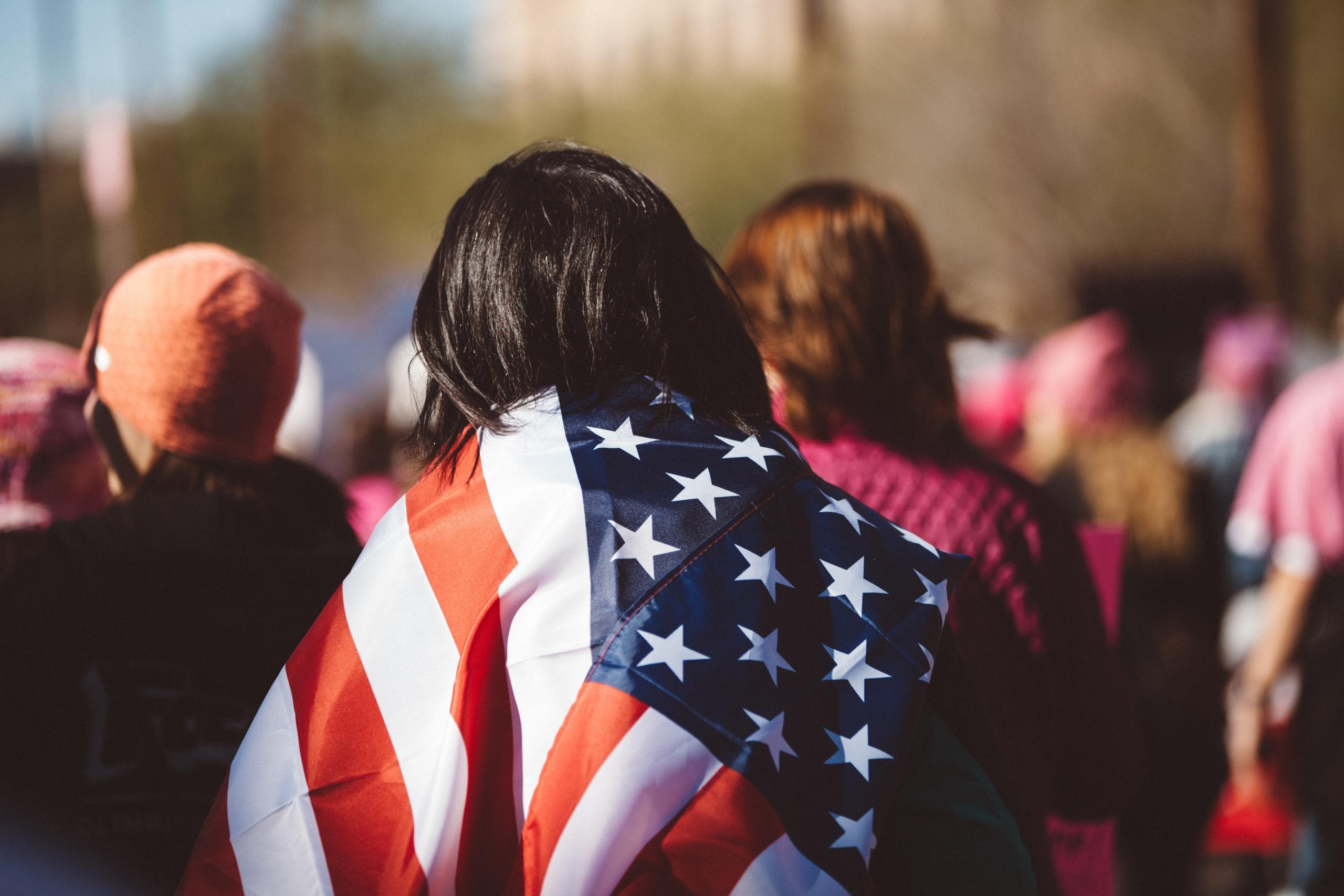 A woman wearing an American flag