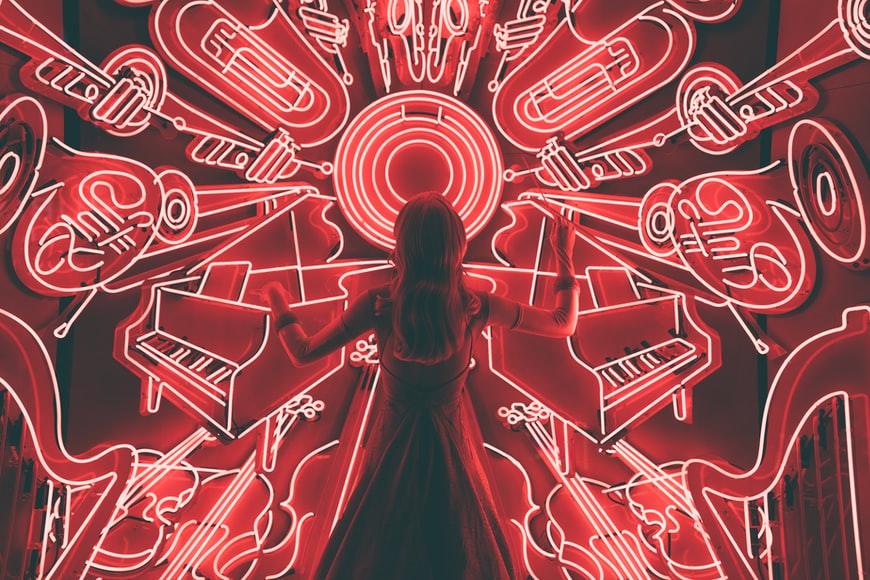 A woman conducting madness of music around her