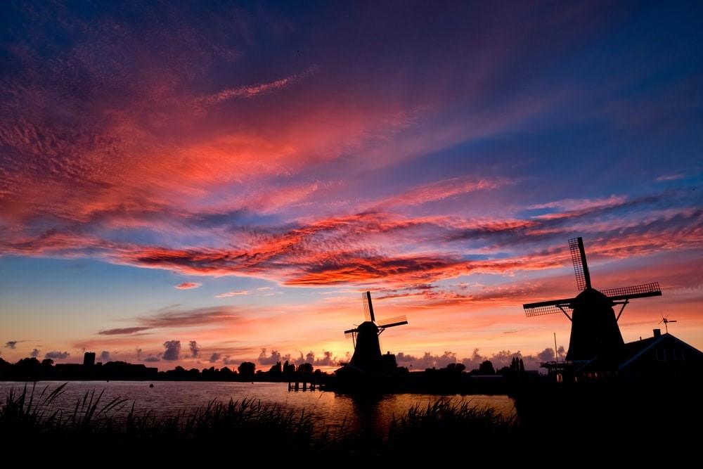 The silhouette of two windmills in the Netherlands