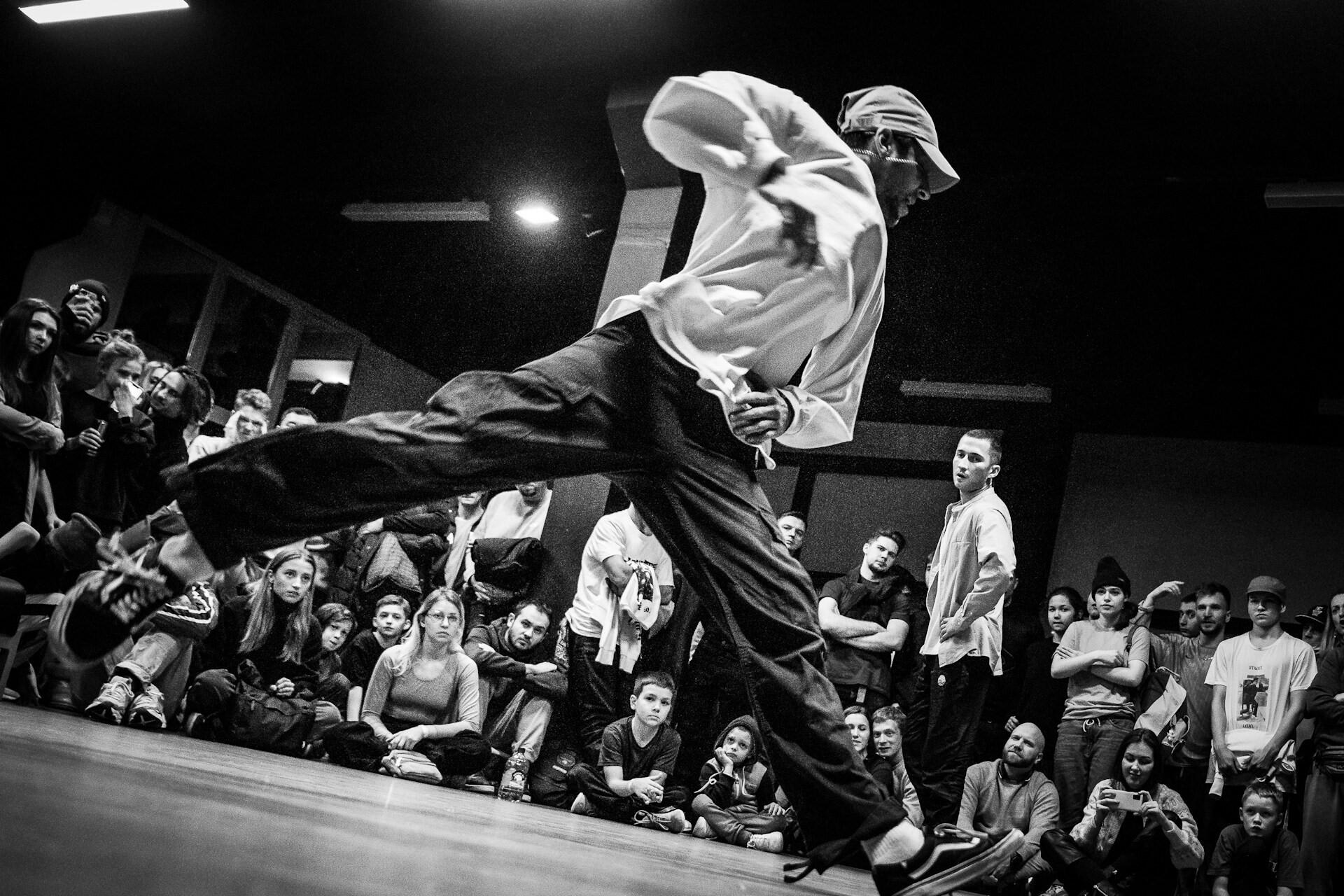 A breakdancer jumping.