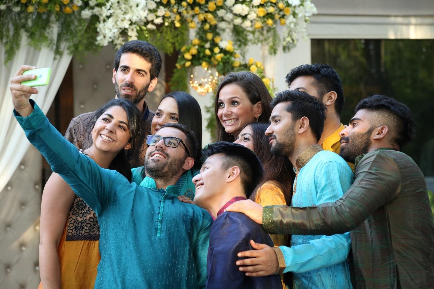 People with different cultural backgrounds taking a selfie