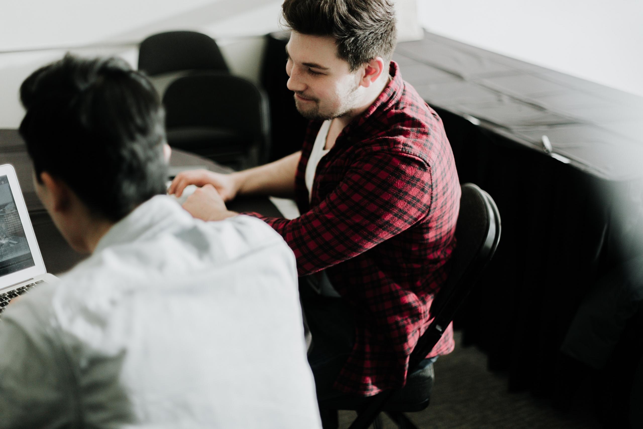 a tutor helping a student with Spanish lessons