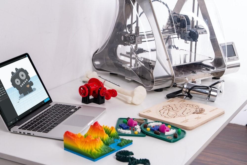 3D printed models in front of a computer