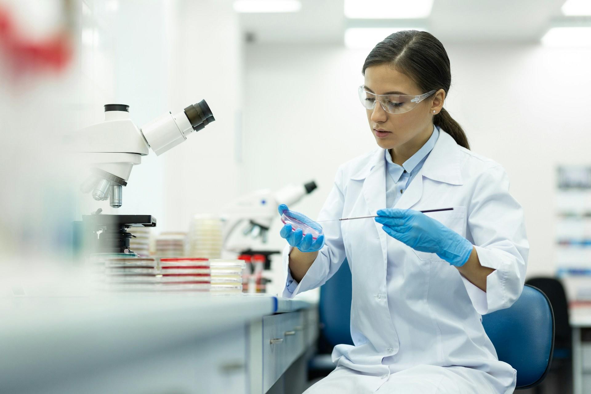 A microbiologist working in a lab.