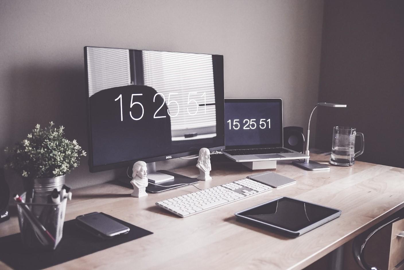 A computer and graphic tab on a desk