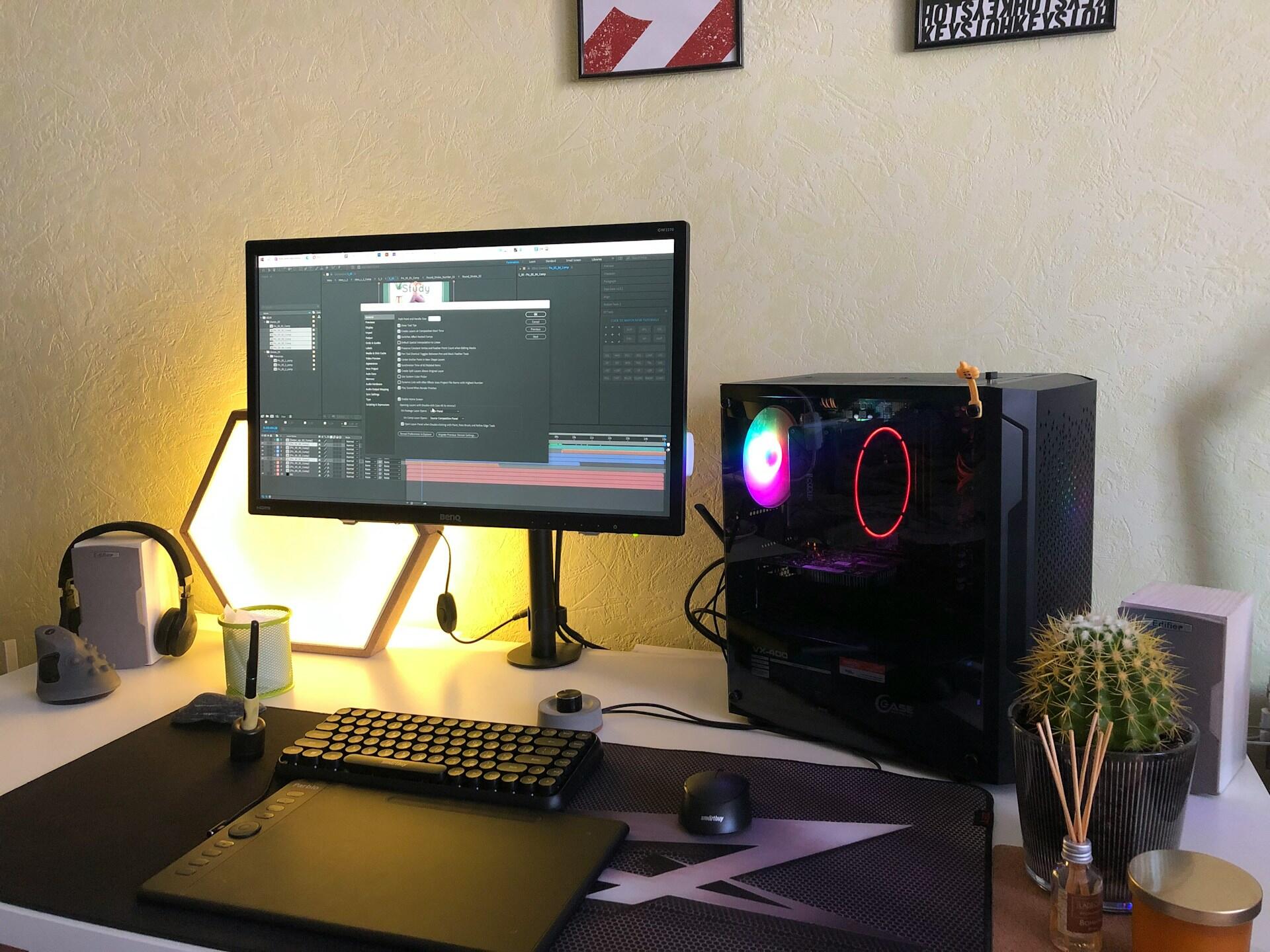 A desk with a yellow light behind it.
