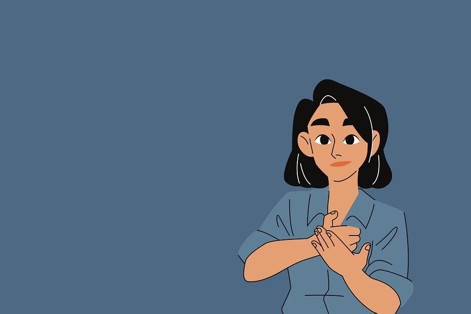 A woman making American Sign Language hand gestures