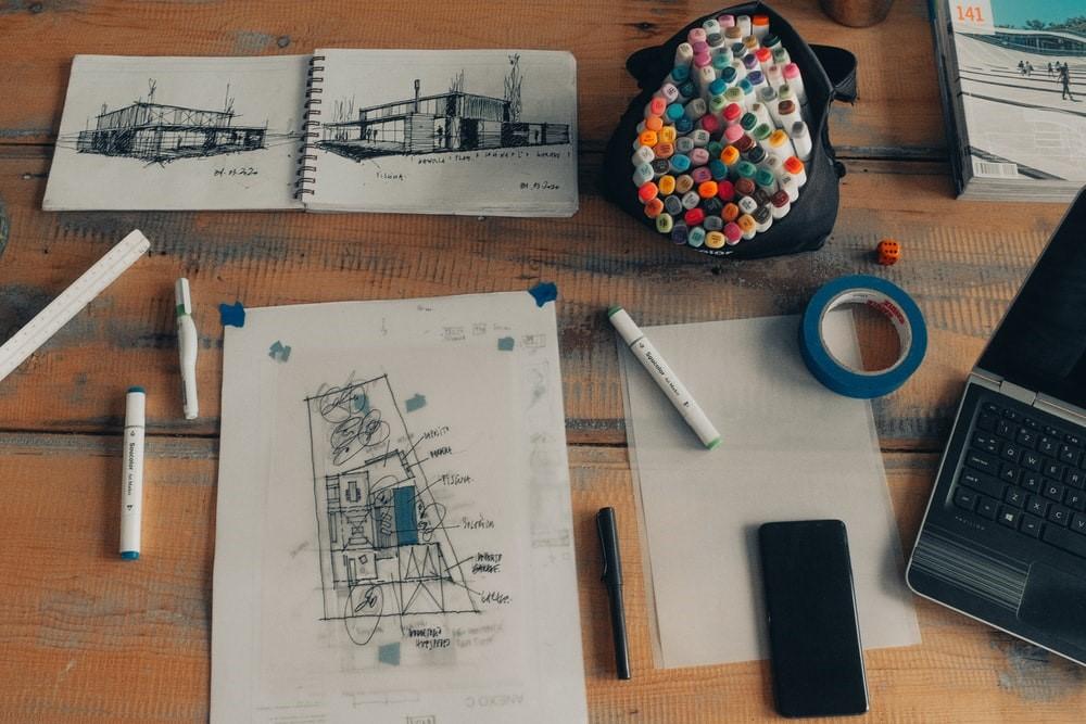 White sketching paper with black laptop