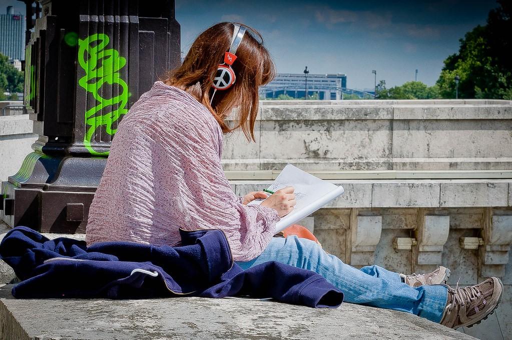 Female sketching in her notebook